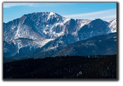 Light falls on the north face of Pikes Peak for the first time this year.