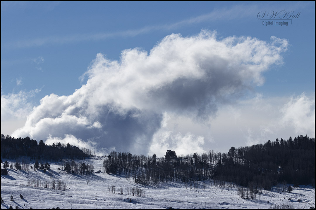 Snow and storm clouds in the Pike National Forest of Colorado
